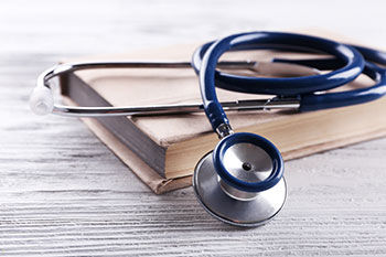 Stethoscope on book