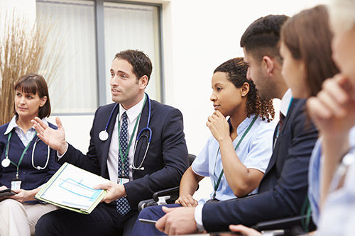 Group of healthcare professionals discussing findings