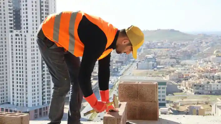 A solar technician installing panels on a house roof, emphasizing renewable energy.