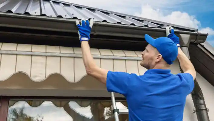 Construction workers repairing a rooftop in a vibrant cityscape.