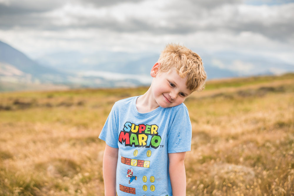 Stan posing on fell, Lake District photographers