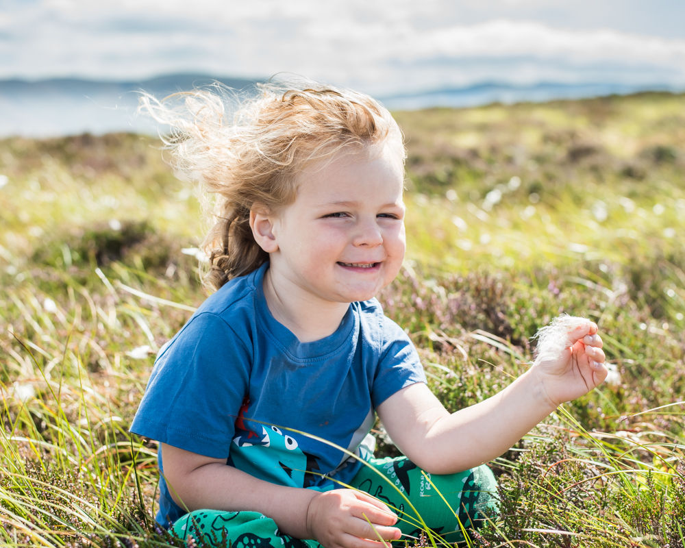 Albert holding fluffy grass, Lake District photographers
