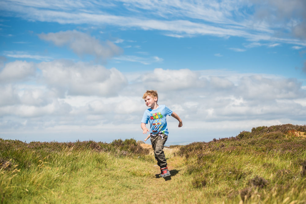 Stan running down hill, Binsey fell, Lake District photographers
