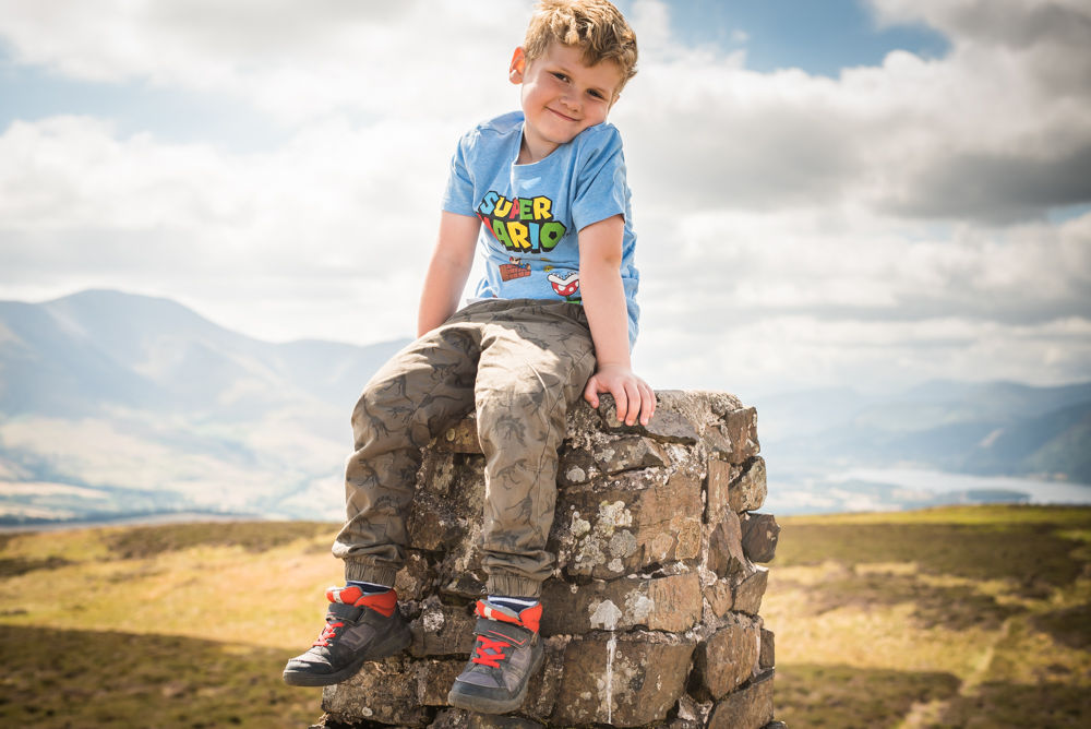 Stan sitting on cairn, Binsey, Lake District photographers