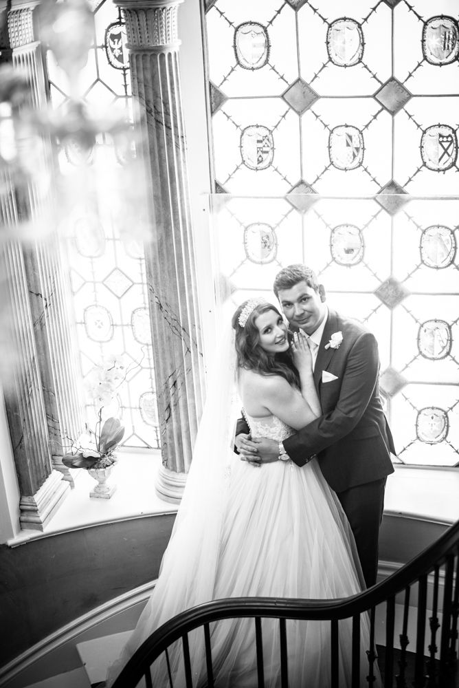 Bride and groom cuddling on stairs, Ripley Castle weddings, Yorkshire wedding photographers