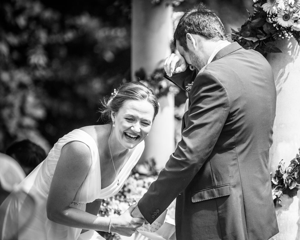 Bride laughing with groom in ceremony, Ringwood Hall weddings, Sheffield wedding photographer
