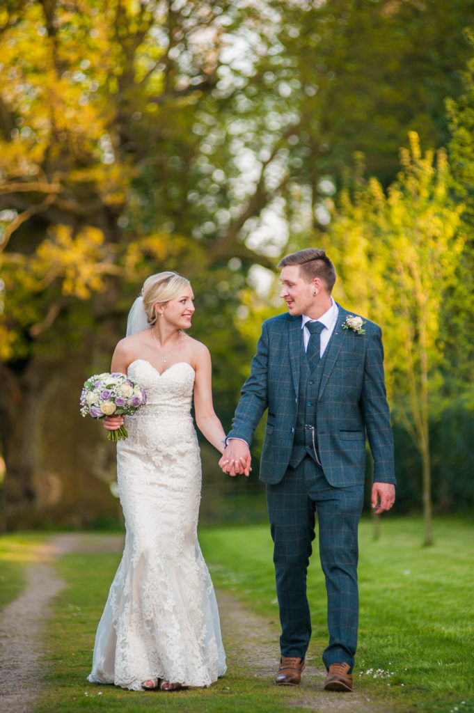 Bride and groom walking in grounds, Wortley Hall, Sheffield wedding photography