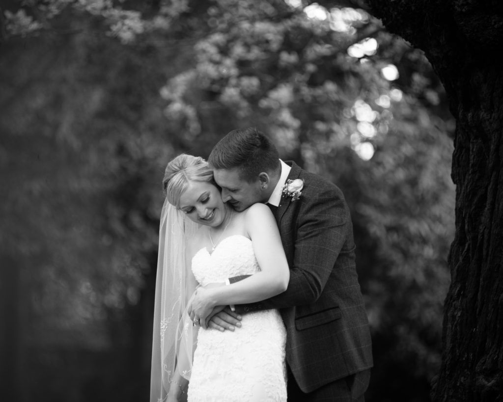 Groom kissing bride's neck, Wortley Hall, Sheffield wedding photography