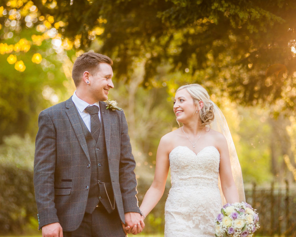 Bride and groom walking in sunset light, Wortley Hall, Sheffield wedding photography