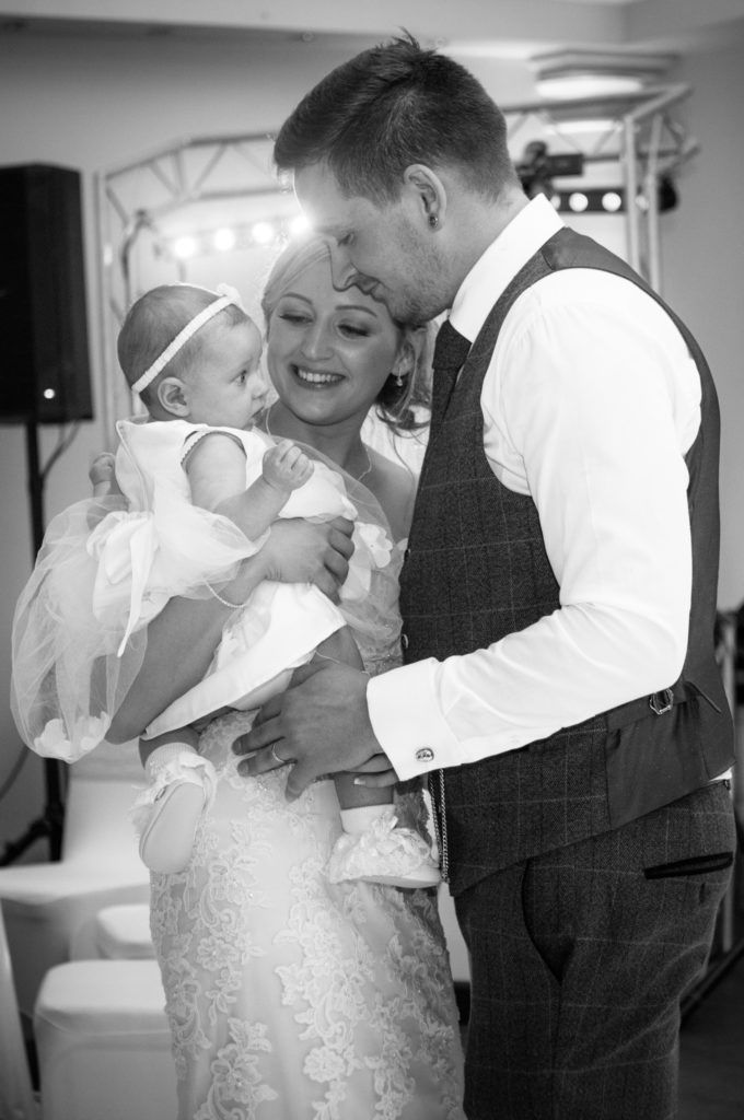 Bride and groom dancing with their daughter, Wortley Hall, Sheffield wedding photography