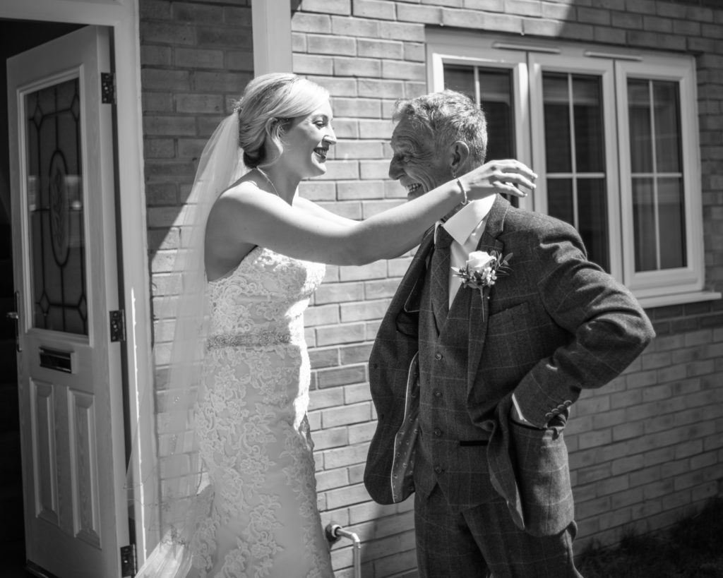 Bride and Dad cuddles in doorway, Wortley Hall, Sheffield wedding photography