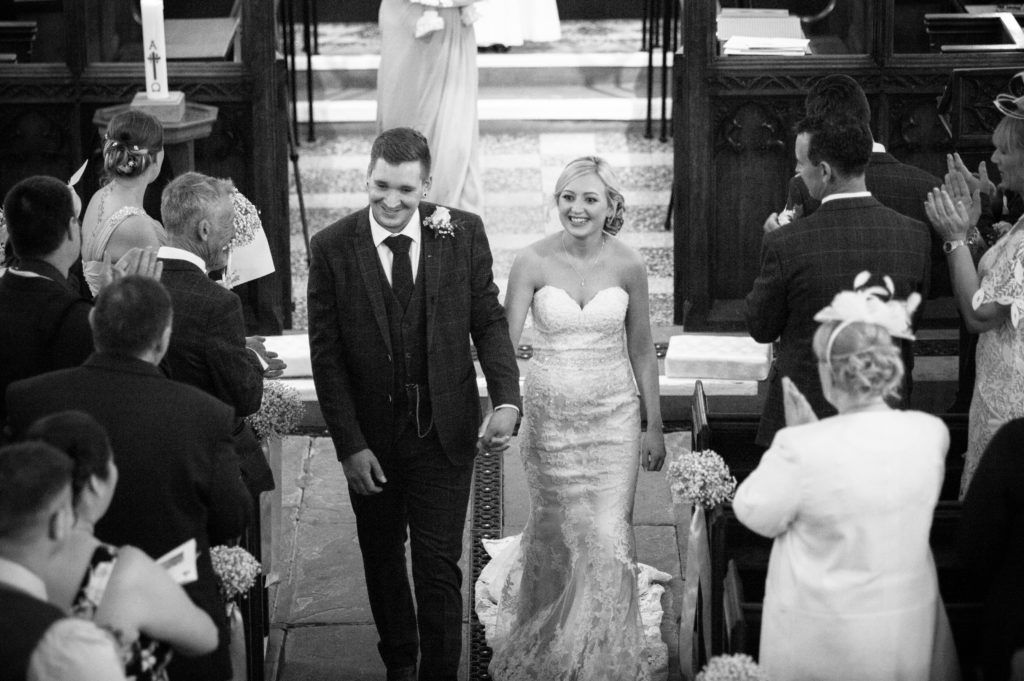 Bride and groom walking down aisle in church, Wortley Hall, Sheffield wedding photography