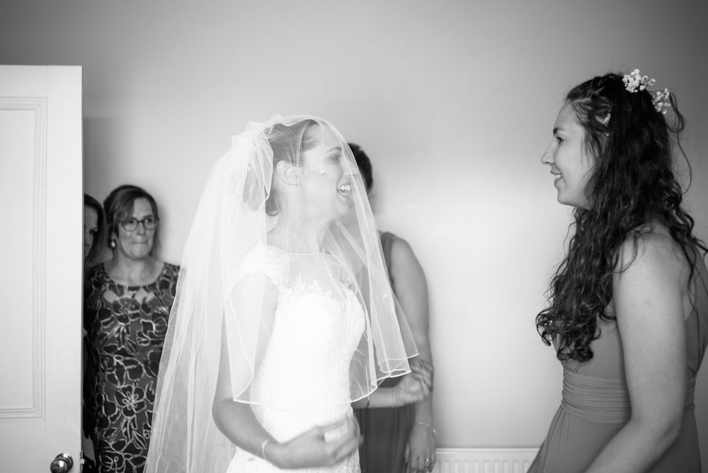Bride putting on dress and bridesmaids reaction, documentary wedding portraits Sheffield, Sheffield-Wedding-Handsworth