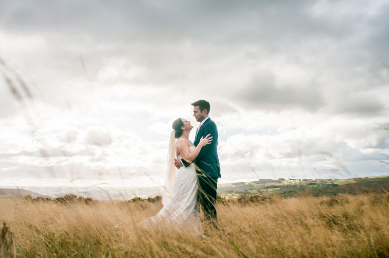 Long grass wedding couple in the Peak District
