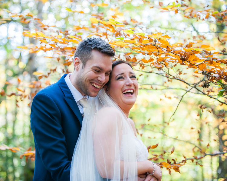 Laughing bride and groom Sheffield rock the dress session