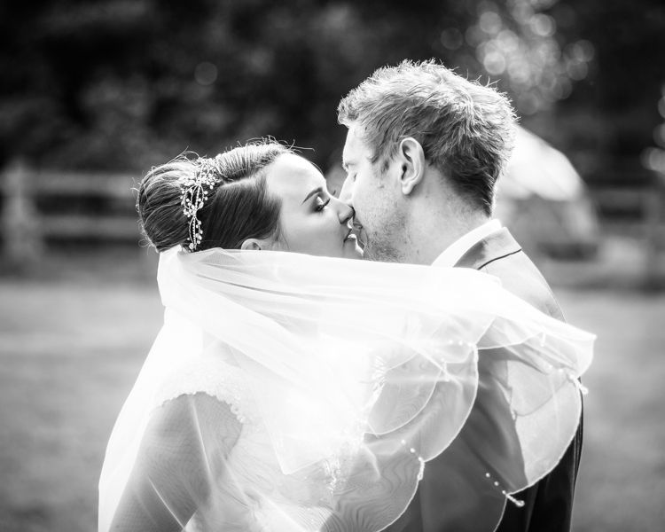 Kisses for bride and groom Joelle & Scott in Sheffield