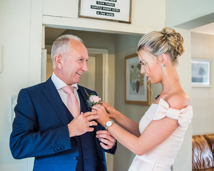 Joelle's Dad getting his buttonhole on for the wedding day