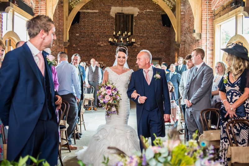 Joelle reaches the top of the aisle at their Sheffield wedding at Hazel Gap Barn