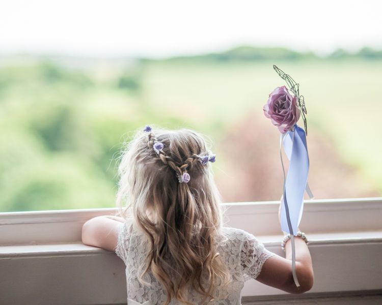 Flower girl looking out of window at Wortley Hall