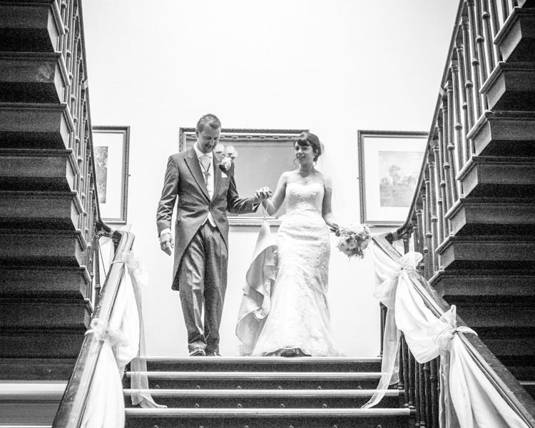 Bride and groom on stairs at Wortley Hall in Sheffield