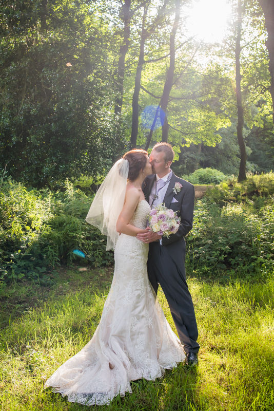 Sunflare cuddle for bride and groom at Wortley Hall in Sheffield
