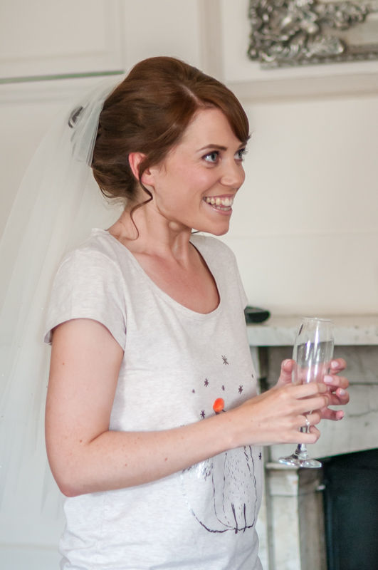 Happy bride with champagne at Wortley Hall