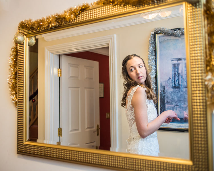 Nikki looking in mirror - Sheffield wedding photographers