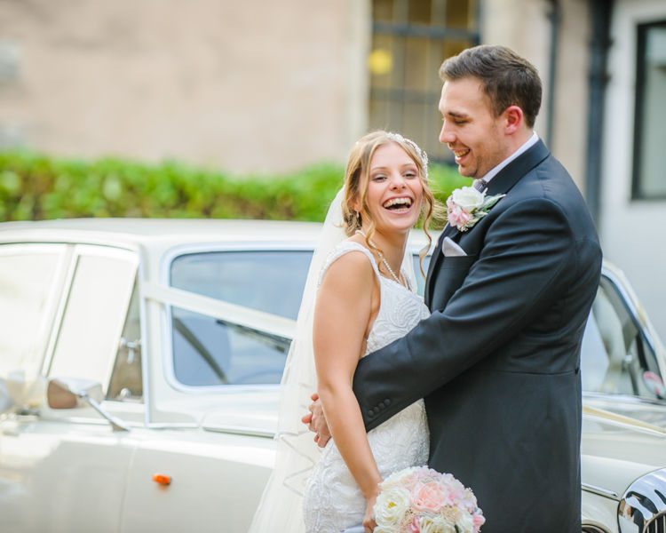 Amanda and Tim with their wedding car,Hellaby Hall wedding photographers Rotherham