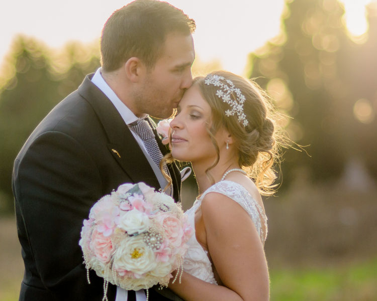 Bride and groom kisses at sunset Hellaby Hall wedding photographers Rotherham