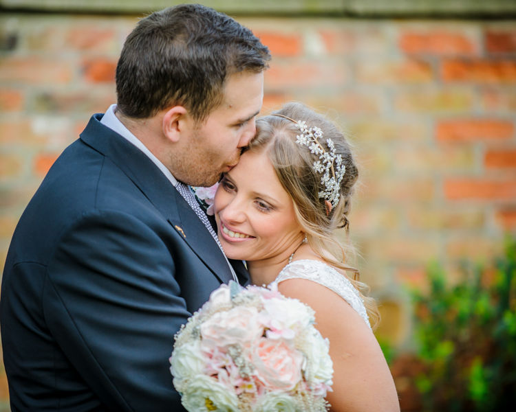 Bride and groom cuddles Hellaby Hall wedding photographers Rotherham