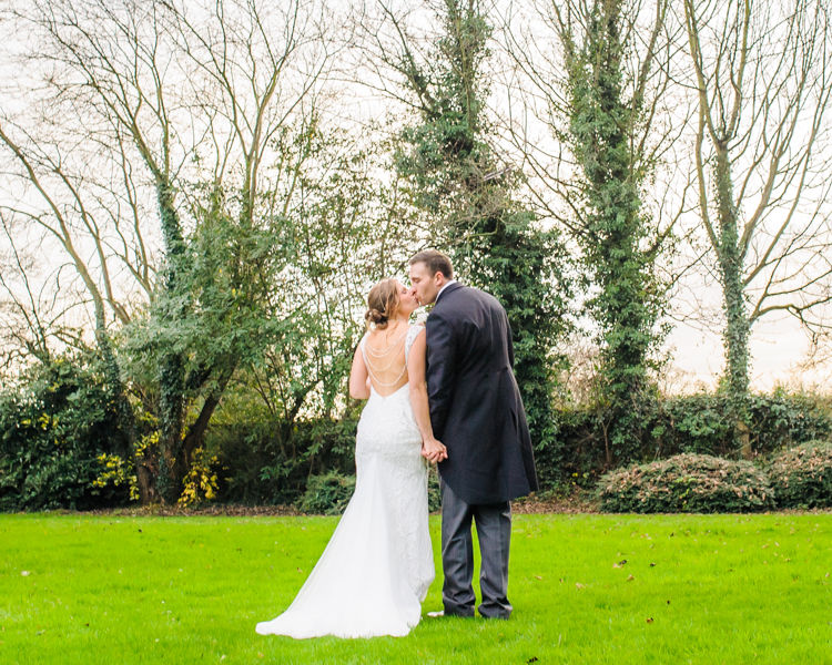Kisses for bride and groom, Hellaby Hall wedding photographers Rotherham