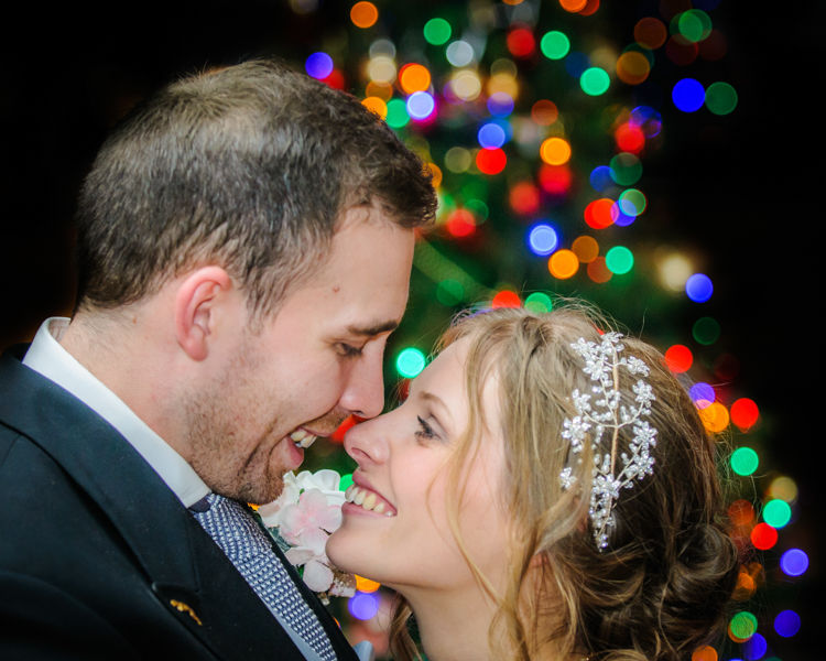 Bride and groom by Christmas tree, Hellaby Hall wedding photographers Rotherham