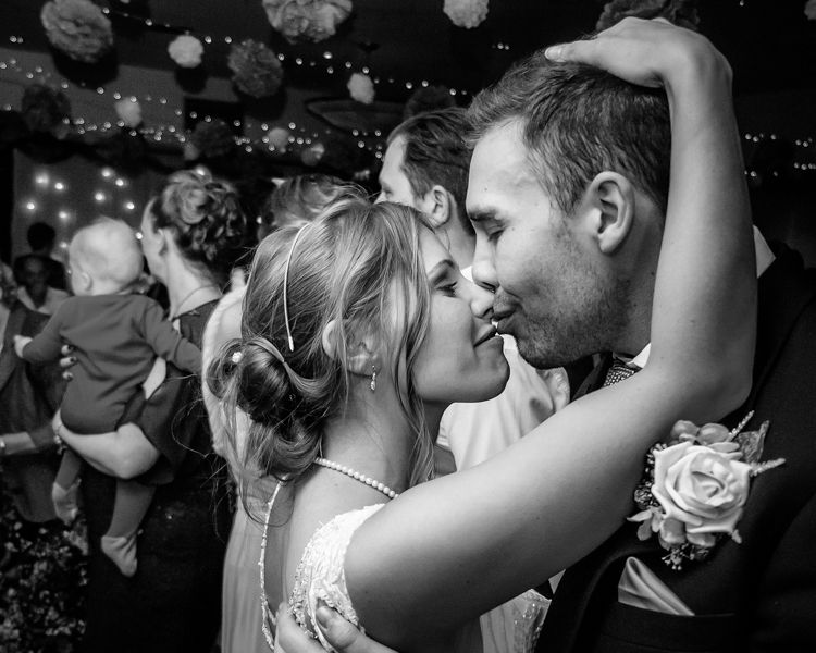 Bride and groom kiss on dancefloor, Hellaby Hall wedding photographers Rotherham