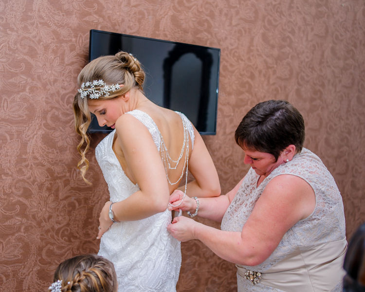 Amanda getting wedding dress on Hellaby Hall wedding photographers Rotherham