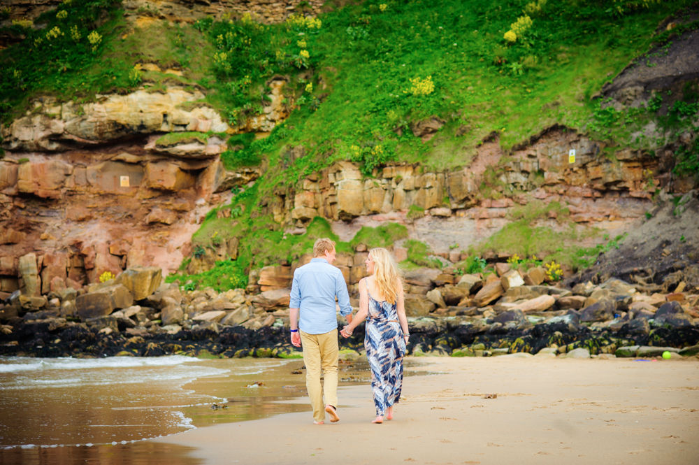 Walking along beach tynemouth
