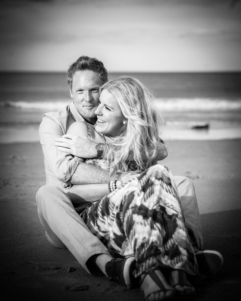 Cuddles on beach, wedding photographer Cumbria