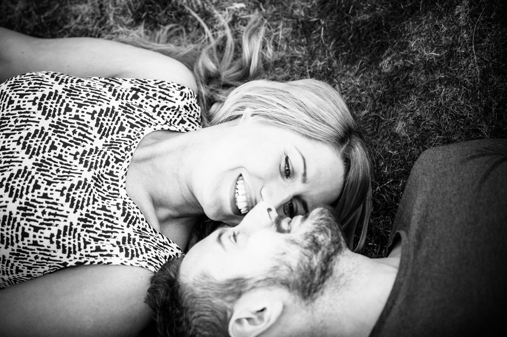 Pre-wedding portraits, Curbar Edge lying in grass