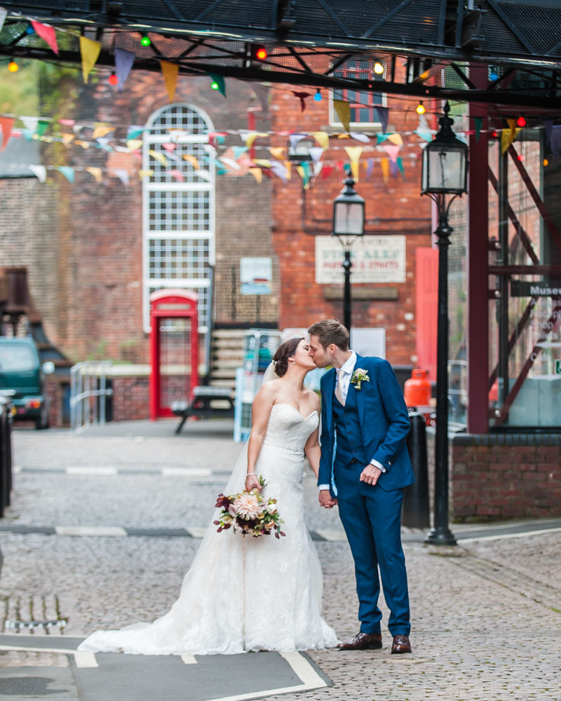 Kisses under bunting, Kelham Island wedding, Sheffield photographers