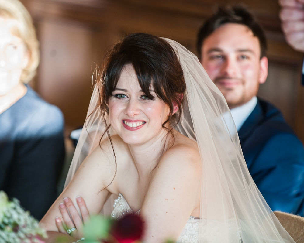 Bride smiling at speeches, Maynard Arms wedding, Sheffield photographers