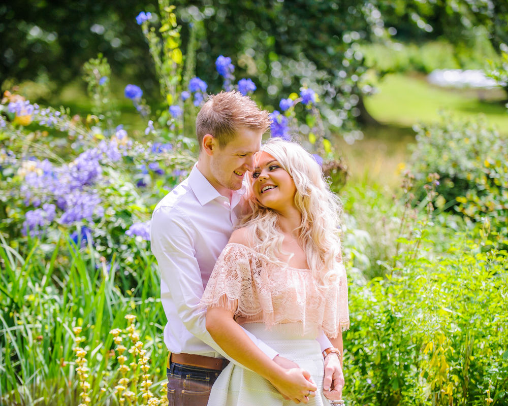 Cuddle in flowers, pre-wedding photos, Sheffield Botanical Gardens