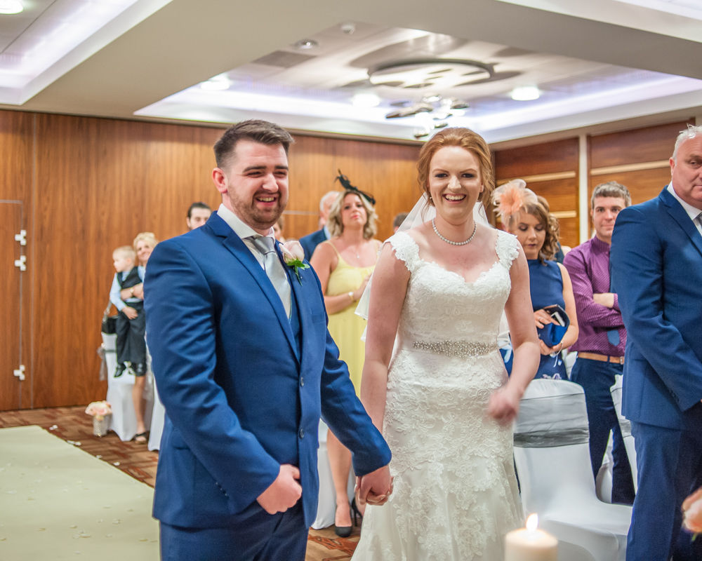 Bride and groom laughing in ceremony, Chesterfield wedding photographer, Casa Hotel