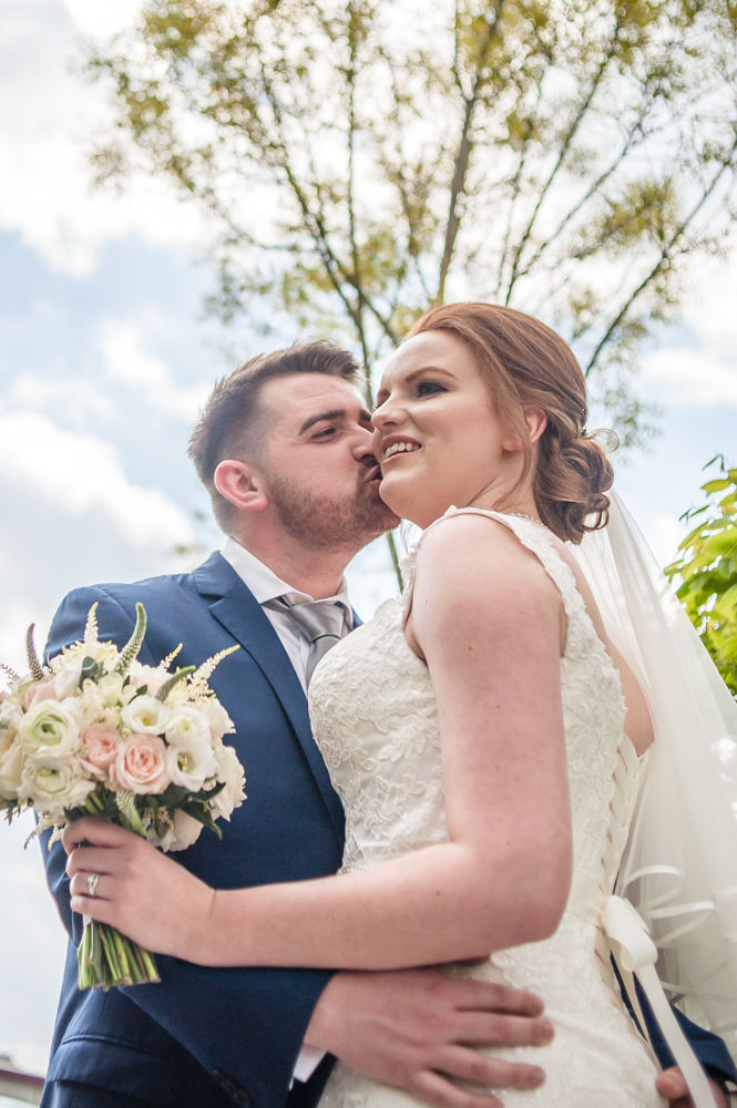 Kisses for bride, Chesterfield wedding photographer, Casa Hotel