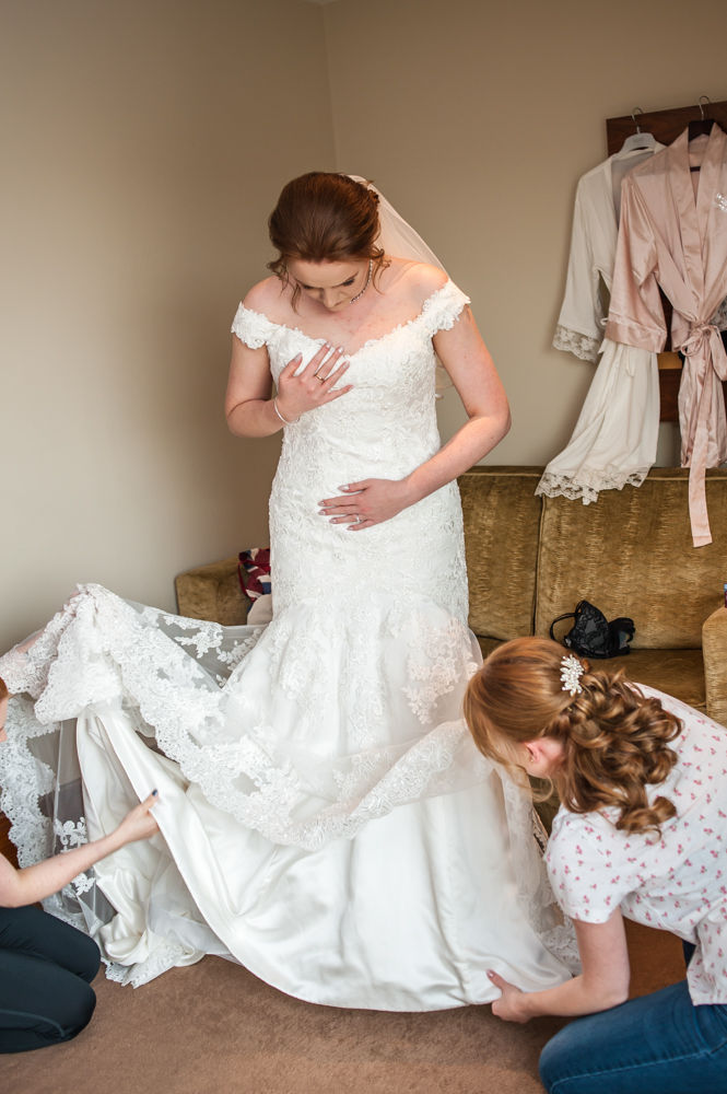 Bride getting dressed, Chesterfield wedding photographer, Casa Hotel