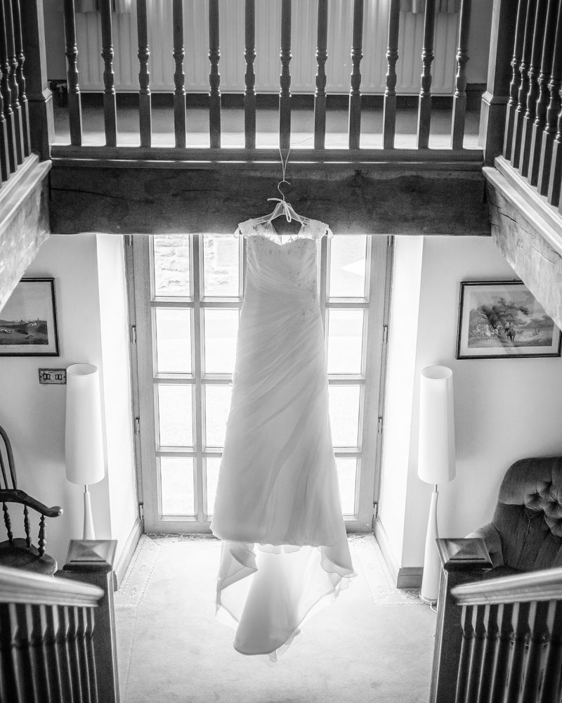 Brides dress hanging up, Sheffield wedding photographers, Smallshaw Farm Cottages