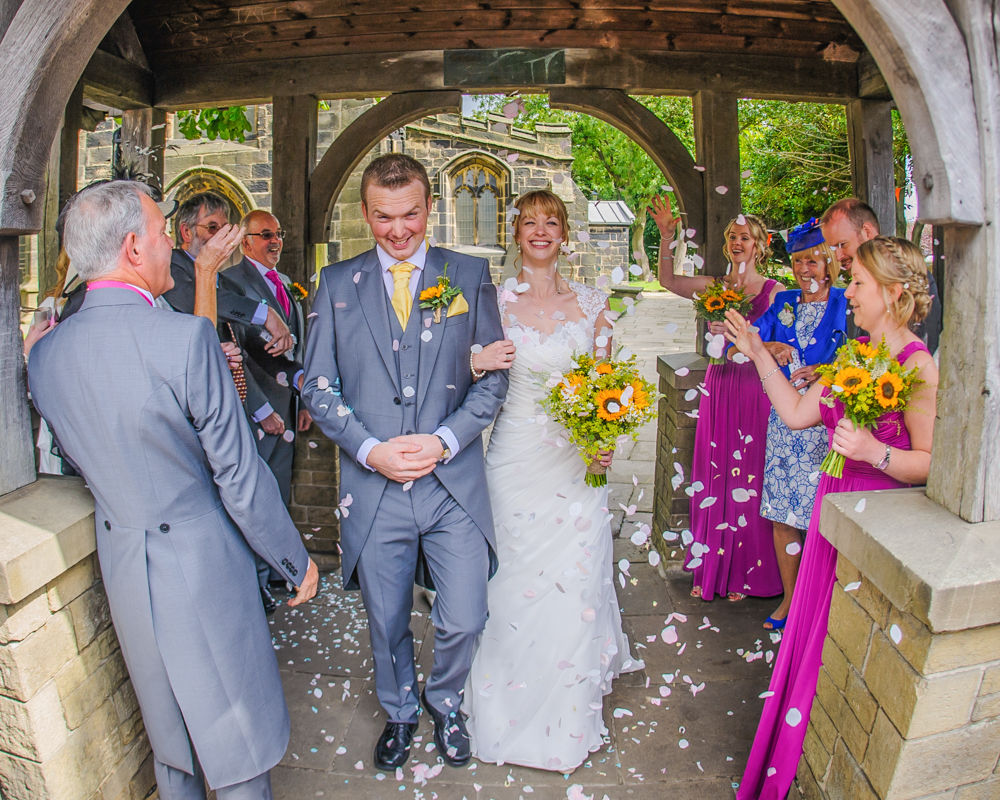 Bride and groom confetti at church, Sheffield wedding photographers, Smallshaw Farm Cottages