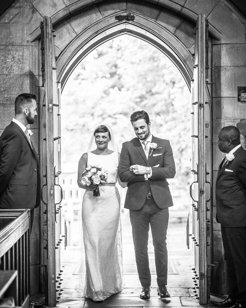 Bride and brother walking into church, St Mary's Ecclesfield, Sheffield