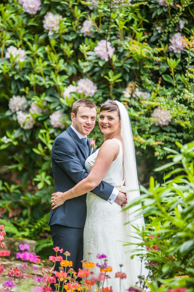 Bride and groom in flower grounds, Sheffield wedding photographers, Whirlowbrook Hall