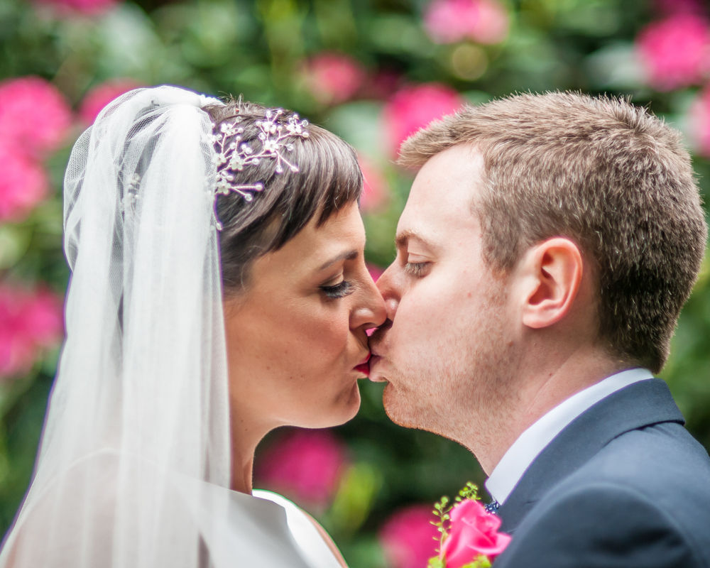 Bride and groom kisses, Sheffield wedding photographers, Whirlowbrook Hall