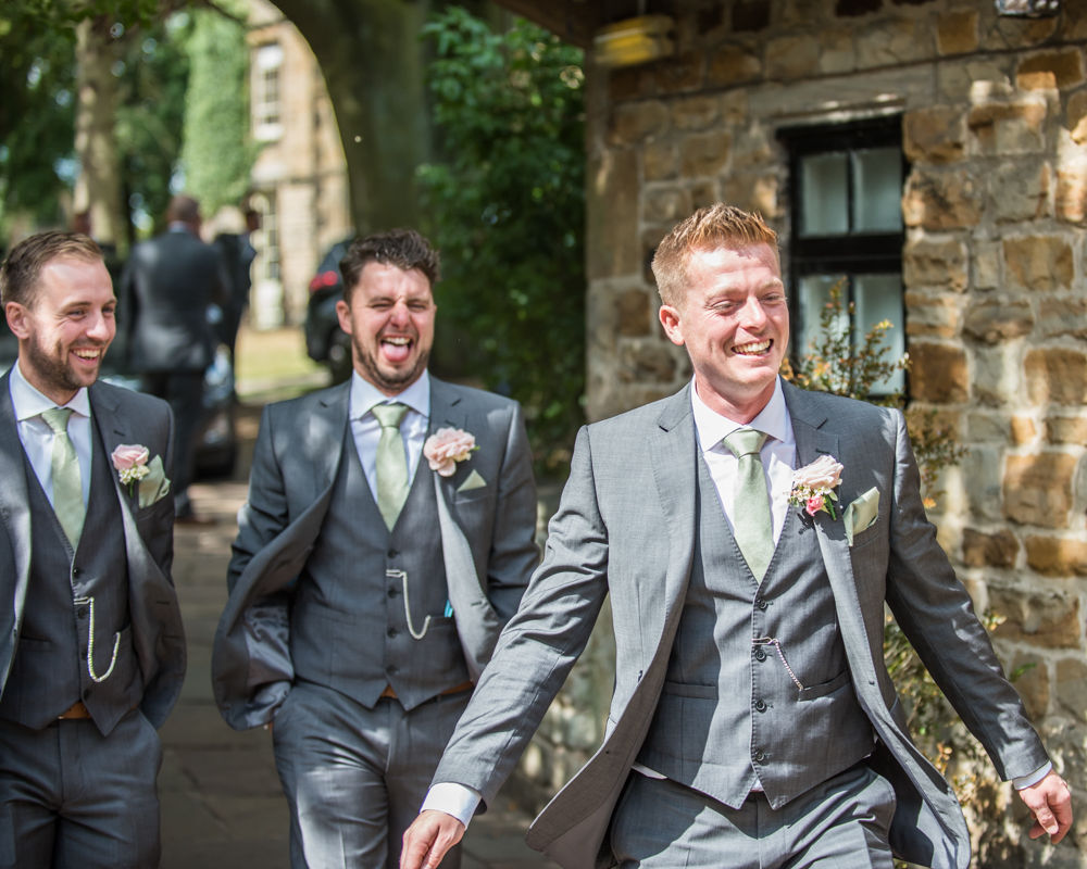 Happy groomsmen on way to wedding, Mosborough Hall wedding