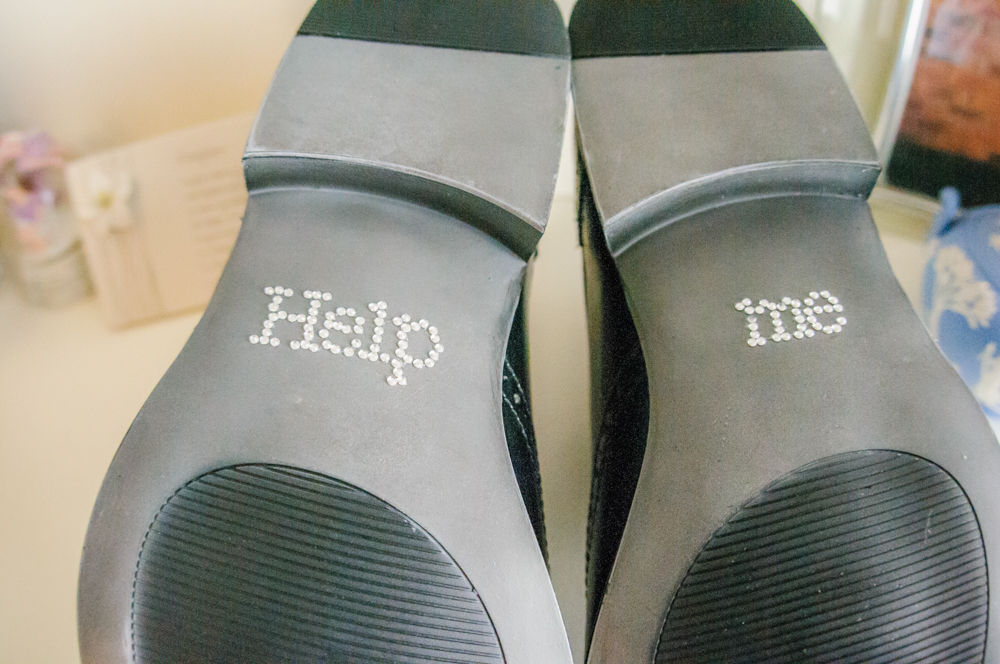Help me on soles of grooms shoes, Lake District wedding photographers